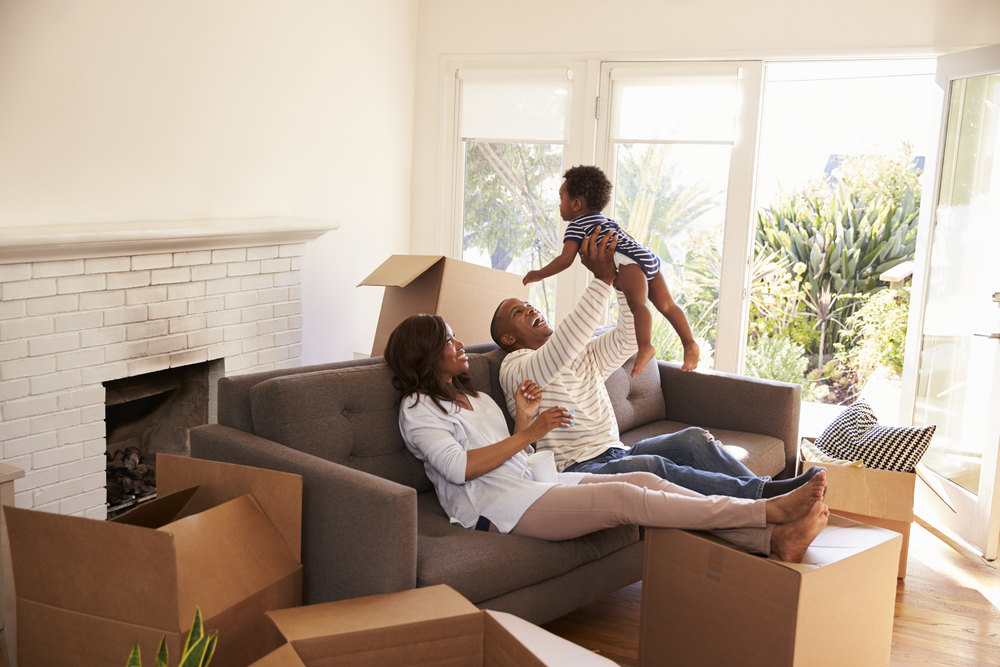 happy family unpacking new home